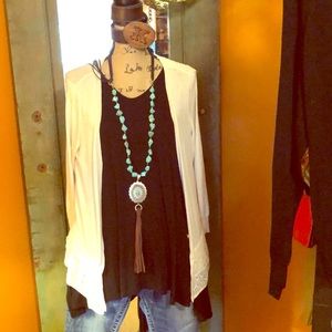 High low black top with 2 black/1 cream sweater